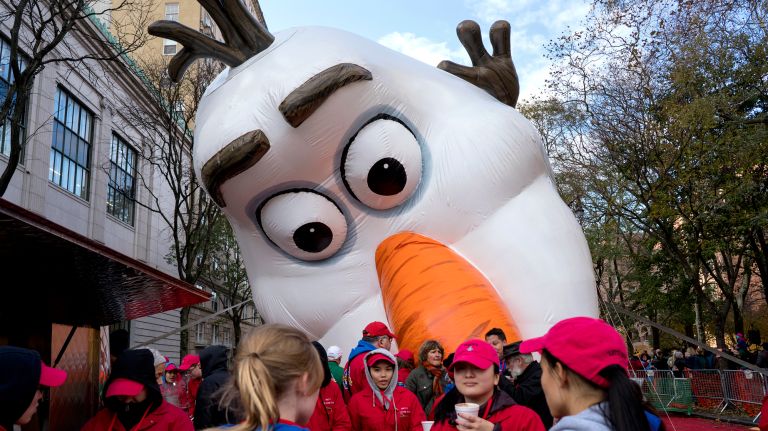 The Olaf balloon is inflated by its crew on 79th Street in Manhattan on Wednesday, Nov. 22, 2017, on the eve of the Macy's Thanksgiving Day Parade.