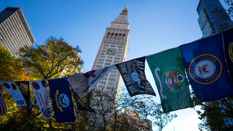 Service flags fly in Madison Square Park during a service during the Veterans Day Parade in Manhattan on Friday, Nov. 11, 2016.
