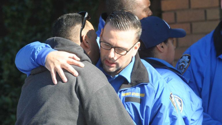 Bronx police shooting: Photos from the scene and more 30 Two NYPD officers greet each other in grief on Saturday, Nov. 5, 2016, outside the 43rd Precinct in the Soundview section of the Bronx. The precinct lost Sgt. Paul Tuozzolo, who was fatally wounded during a shootout with a suspect in the Van Nest neighborhood.