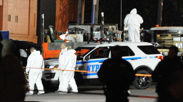 Bronx police shooting: Photos from the scene and more 35 Investigators work over an area in the Van Nest neighborhood of the Bronx, where two NYPD officers were wounded, one fatally, and a domestic violence suspect killed in a shootout on Friday, Nov. 4, 2016.