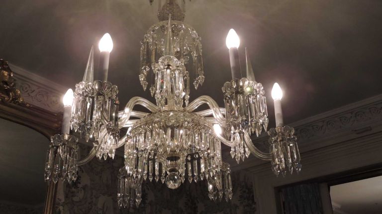 The parlor's focal point is this lead crystal chandelier made by the family's business, which was near Maiden Lane in the Financial District. 