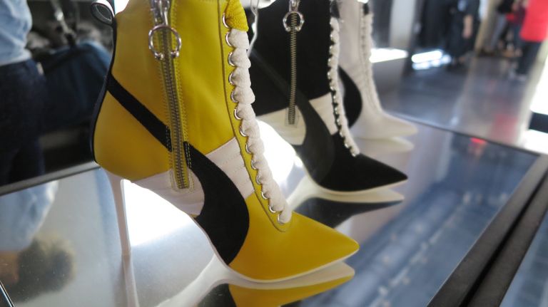 Rihanna's NYC pop-up debuts latest Puma collaboration ahead of NYFW 11 Rihanna's take on the heeled sneaker transforms Puma's typical striped design into pointed-toe pumps.