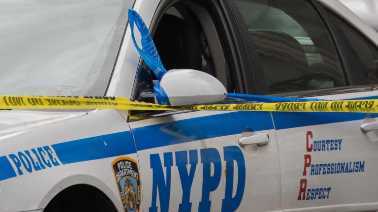 A robbery suspect fleeing police crashed into another car in Queens on Thursday, July 7, 2016, police said. The woman driving the other vehicle was pronounced dead at the scene, according to the NYPD.