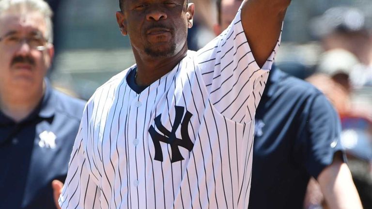 Former New York Yankees player Rickey Henderson waves to fans during the 70th annual Old-Timers' Day at Yankee Stadium on Sunday, June 12, 2016.