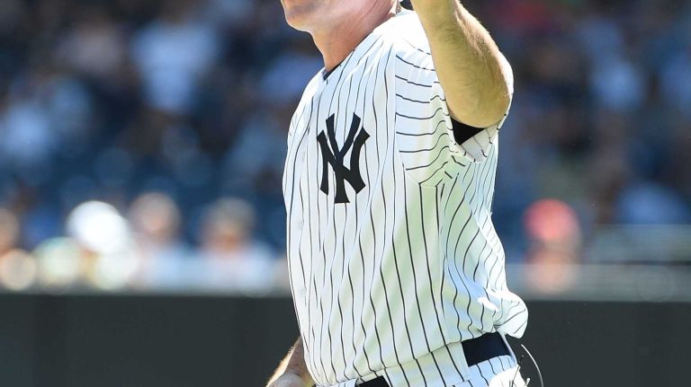 Former New York Yankees player John Flaherty waves to fans during the 70th annual Old-Timers' Day at Yankee Stadium on Sunday, June 12, 2016.