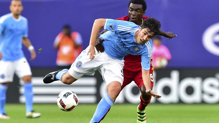 NYCFC vs. Real Salt Lake 38 New York City FC defender Andoni Iraola (51) is tripped up by Real Salt Lake midfielder Stephen Sunny Sunday (8) in an MLS game at Yankee Stadium in Bronx, New York on Thursday, Jun 2, 2016.