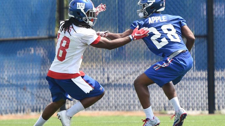 New York Giants cornerback Eli Apple, right, and wide receiver Geremy Davis runs a drill during the Giants Organized Team Activities at Quest Diagnostics Training Center on Wednesday, June 1, 2016.
