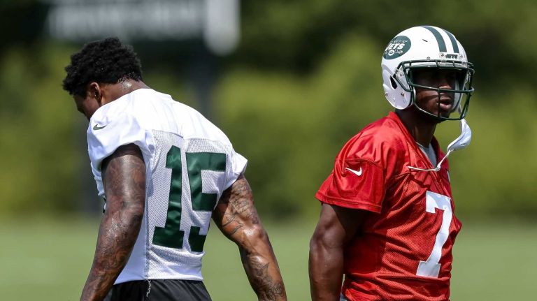 Quarterback Geno Smith and Jets receiver Brandon Marshall high five during the Jets' OTAs on Wednesday, June 1, 2016 in Florham Park, N.J.