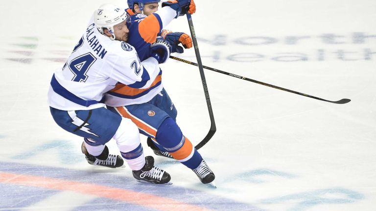 Tampa Bay Lightning right wing Ryan Callahan (24) and New York Islanders center John Tavares (91) battle for the loose puck in the second period in Game 3 of the Eastern Conference semifinals on Tuesday, May 3, 2016 at Barclays Center.