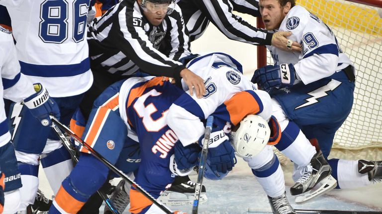 Tampa Bay Lightning left wing Ondrej Palat (18) fights with New York Islanders defenseman Travis Hamonic (3) in the second period in Game 3 of the Eastern Conference semifinals on Tuesday, May 3, 2016 at Barclays Center.