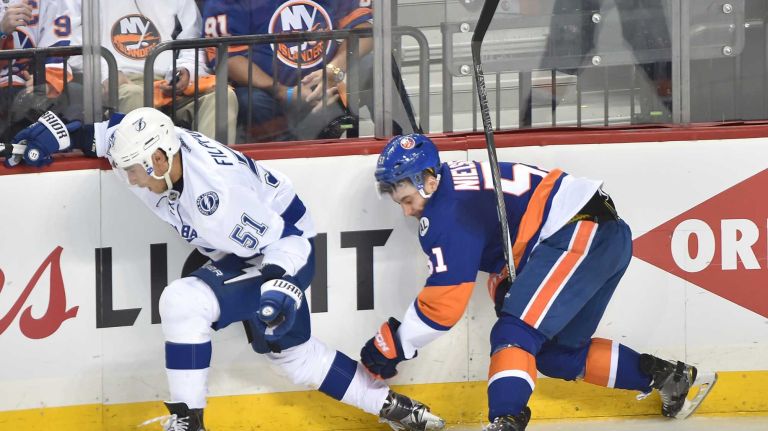 Tampa Bay Lightning center Valtteri Filppula (51) and New York Islanders center Frans Nielsen (51) battle against the boards in the second period in Game 3 of the Eastern Conference semifinals on Tuesday, May 3, 2016 at Barclays Center.