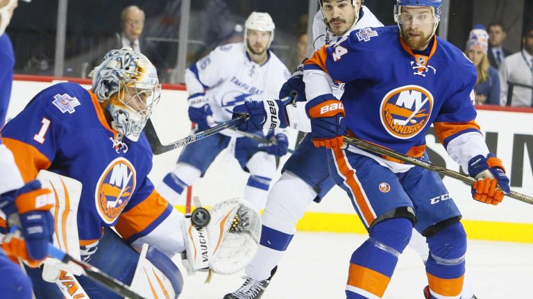 New York Islanders goalie Thomas Greiss (1) tries to stop the goal by Tampa Bay Lightning right wing Ryan Callahan (24) in the first period in Game 3 of the Eastern Conference semifinals on Tuesday, May 3, 2016 at Barclays Center.