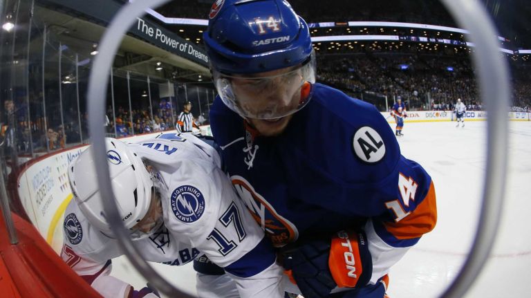 Tampa Bay Lightning center Alex Killorn (17) and New York Islanders defenseman Thomas Hickey (14) battle in the boards in the first period of Game 3 of the Eastern Conference semifinals on Tuesday, May 3, 2016 at Barclays Center.