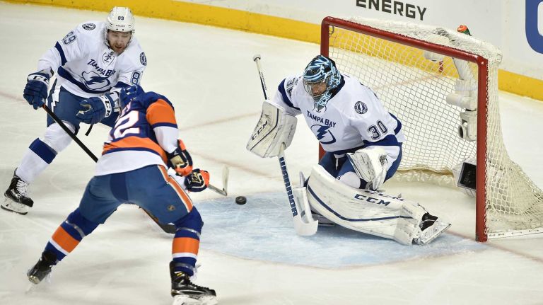 New York Islanders left wing Josh Bailey (12) scores a goal against Tampa Bay Lightning goalie Ben Bishop (30) in the first period in Game 3 of the Eastern Conference semifinals on Tuesday, May 3, 2016 at Barclays Center.