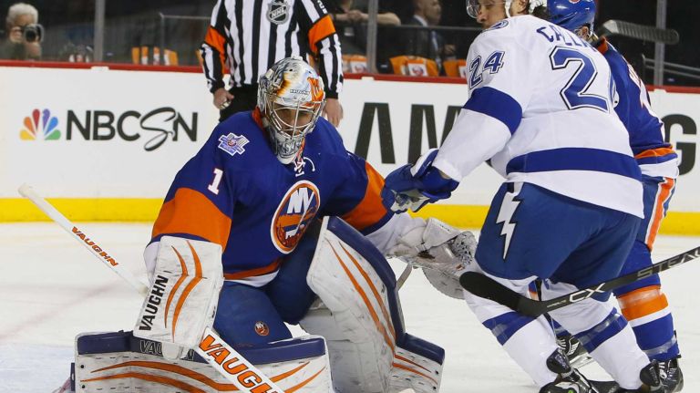 New York Islanders goalie Thomas Greiss (1) stops the shot as Tampa Bay Lightning right wing Ryan Callahan (24) and New York Islanders defenseman Thomas Hickey (14) are in the crease in Game 3 of the Eastern Conference semifinals on Tuesday, May 3, 2016 at Barclays Center.