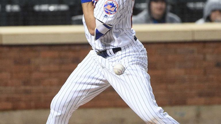 Mets vs. Braves 23 New York Mets catcher Kevin Plawecki is hit by a pitch by Atlanta Braves starting pitcher Matt Wisler during the third inning of an MLB baseball game at Citi Field on Tuesday, May 3, 2016.