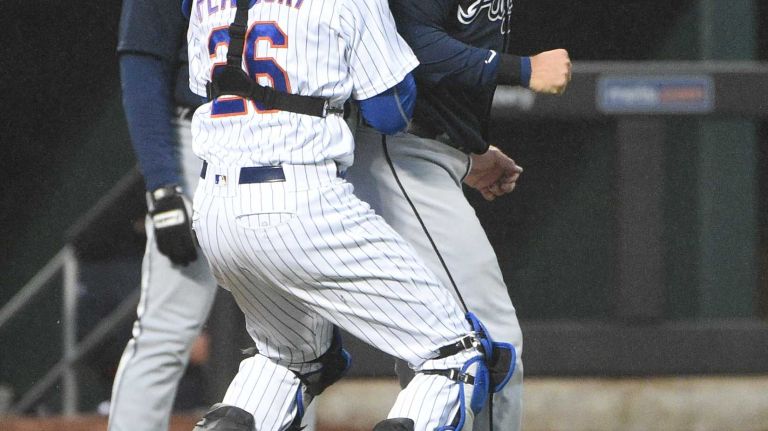 Mets vs. Braves 25 New York Mets catcher Kevin Plawecki tags out Atlanta Braves catcher A.J. Pierzynski during the second inning of an MLB baseball game at Citi Field on Tuesday, May 3, 2016.