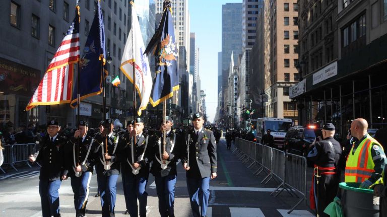 A New York National Guard color guard prepares to step onto the route for the St. Patrick's Day parade along Fifth Avenue in Manhattan on Thursday, March 17, 2016.