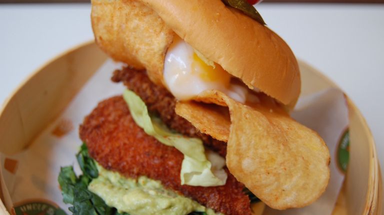 Uncle Sam's in NYC debuts fried chicken sandwich topped with Sriracha potato chips, poached egg 8 That's thanks to the Sriracha flavoring. Who doesn't want an extra kick?