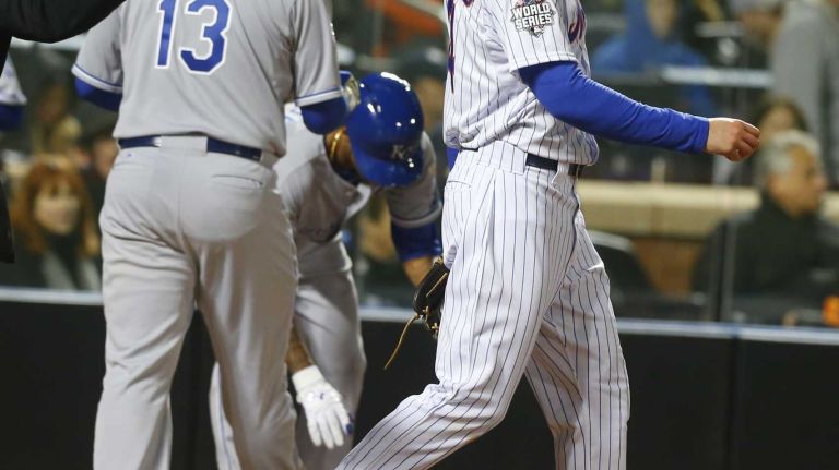 New York Mets starting pitcher Noah Syndergaard looks on as Kansas City Royals catcher Salvador Perez scores in the second inning during Game 3 of the World Series at Citi Field on Friday, Oct. 30, 2015.