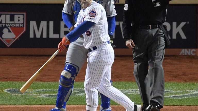 New York Mets third baseman David Wright hits a two-run home run in the first inning during Game 3 of the World Series against the Kansas City Royals at Citi Field on Friday, Oct. 30, 2015.