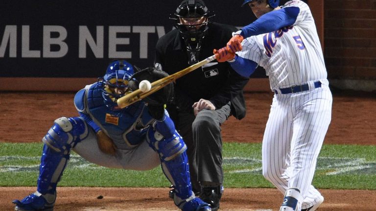 New York Mets third baseman David Wright hits a two-run home run in the first inning during Game 3 of the World Series against the Kansas City Royals at Citi Field on Friday, Oct. 30, 2015.