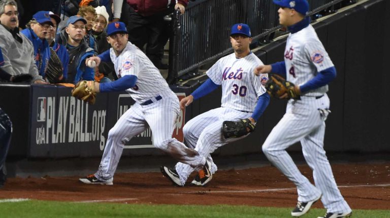 New York Mets third baseman David Wright (5) grabs the ball hit by Kansas City Royals catcher Salvador Perez (13) in second inning during Game 3 of the World Series against the Kansas City Royals at Citi Field on Friday, Oct. 30, 2015.