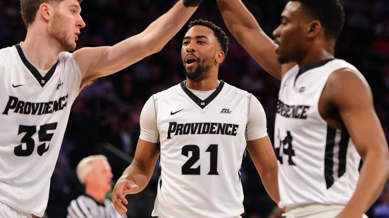 Providence guard Jalen Lindsey (21) celebrates a basket with guard Ryan Fazekas (35) and guard Kyron Cartwright (24) against Butler during the Big East Tournament at Madison Square Garden in New York, New York on Thursday, Mar 10, 2016. Big East Basketball Tournament between #5 Butler and #4 Providence.