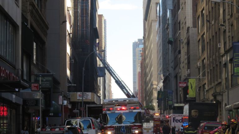 Authorities respond to the scene of a fatal building collapse at 25 W. 38th St.