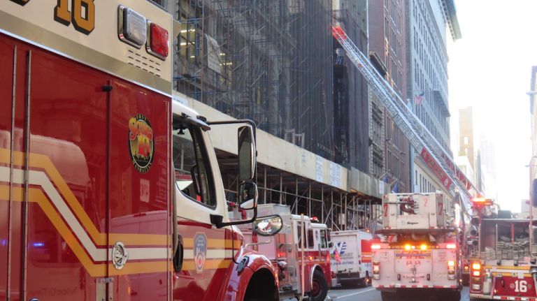 Authorities respond to the scene of a fatal building collapse at 25 W. 38th St.