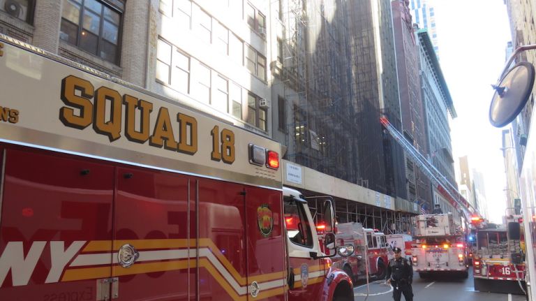 Authorities respond to the scene of a fatal building collapse at 25 W. 38th St.