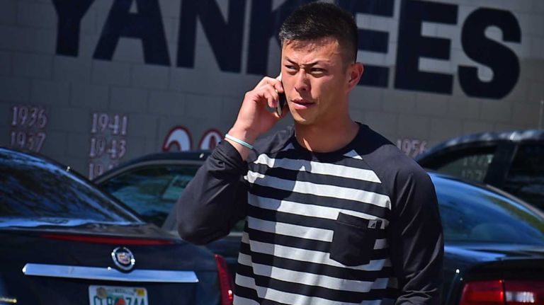 New York Yankees spring training 2016 169 New York Yankees second baseman Rob Refsnyder speaks on his cell phone as he leaves the Yankees' minor league facility in Tampa, Fla. on Wednesday, Feb. 17, 2016.