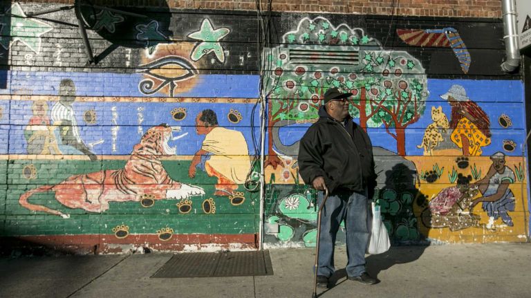 Chris Minor, a retired bus driver, and Crown Heights resident, waits for the bus in Crown Heights, Brooklyn on Jan. 13, 2016.