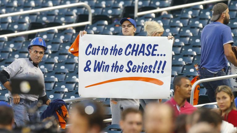 A Mets fan holds a banner ahead of Game 3 of the NLDS against the Los Angeles Dodgers at Citi Field on Monday, Oct. 12, 2015.
