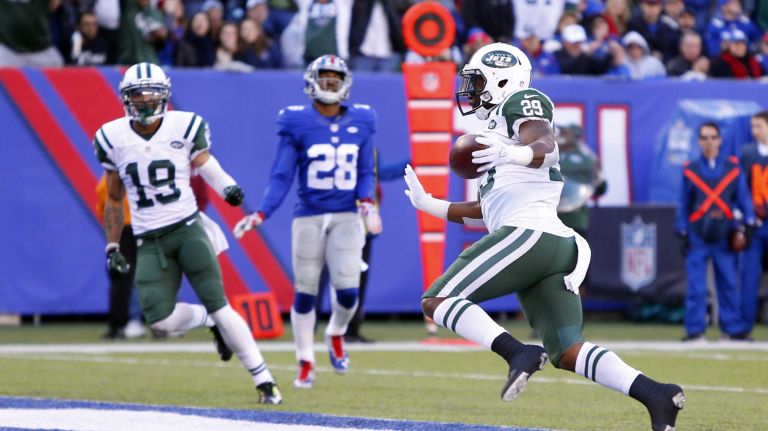 Bilal Powell #29 of the New York Jets runs in a touchdown in the first half against the New York Giants at MetLife Stadium on Sunday, Dec. 6, 2015 in East Rutherford, N.J.