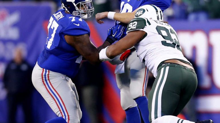 Leonard Williams #92 of the New York Jets puts pressure on Eli Manning #10 of the New York Giants at MetLife Stadium on Dec. 6, 2015 in East Rutherford, N.J.