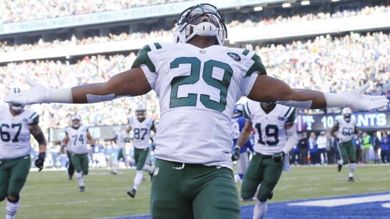 Bilal Powell #29 of the New York Jets celebrates after he caught a touchdown pass against the New York Giants at MetLife Stadium on Dec. 6, 2015 in East Rutherford, N.J.