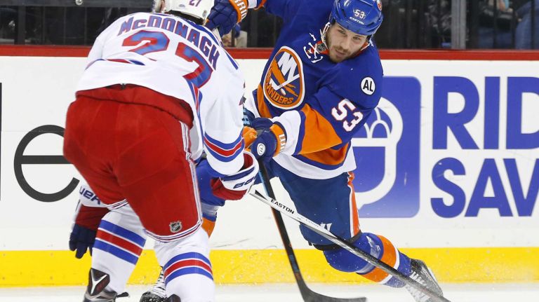Casey Cizikas #53 of the New York Islanders shoots the puck in the first period against Ryan McDonagh #27 of the New York Rangers at Barclays Center on Wednesday, Dec. 30, 2015 in Brooklyn, New York.
