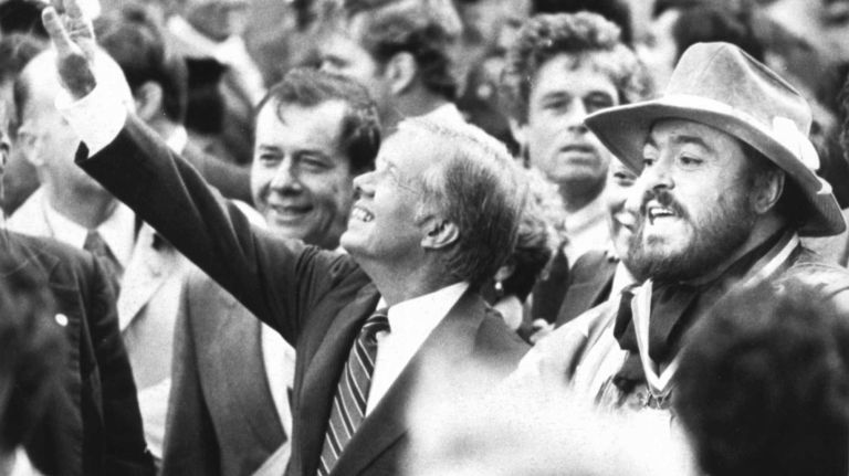 Tenor Luciano Pavarotti, Grand Marshal of the Columbus Day Parade, with President Jimmy Carter during Columbus Day Parade in New York on October 13, 1980. 