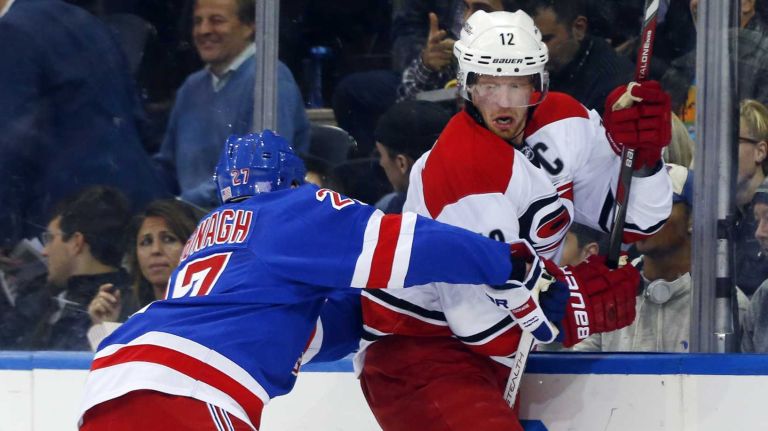 Ryan McDonagh of the New York Rangers defends against Eric Staal of the Carolina Hurricanes during the second period at Madison Square Garden on Tuesday, Nov. 10, 2015.