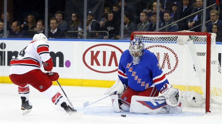 Henrik Lundqvist of the New York Rangers makes a save in the second period against Nathan Gerbe of the Carolina Hurricanes at Madison Square Garden on Tuesday, Nov. 10, 2015.