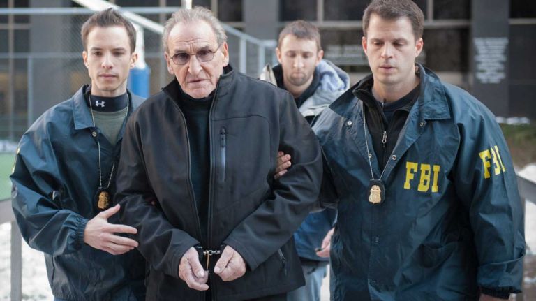 FBI agents escort Vincent Asaro from FBI offices in lower Manhattan. Asaro has been arrested in connection with the infamous Lufthansa heist at Kennedy Airport in 1978, according to a federal indictment. (Jan. 23, 2014)