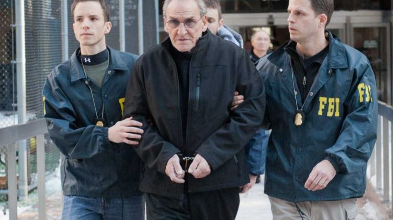 FBI agents escort Vincent Asaro from FBI offices in lower Manhattan. Asaro has been arrested in connection with the infamous Lufthansa heist at Kennedy Airport in 1978, according to a federal indictment. (Jan. 23, 2014)