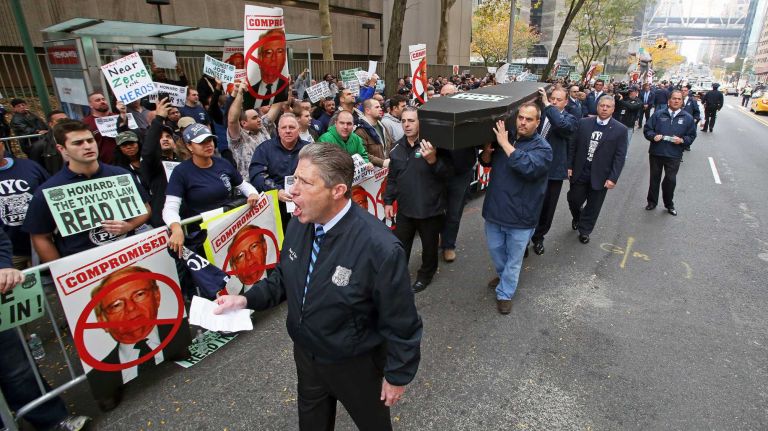NYC Patrolmen Benevolent Association members, led by PBA president Pat Lynch, express their discontent with a proposed 1 percent raise in Manhattan on Thursday, Nov. 5, 2015.
