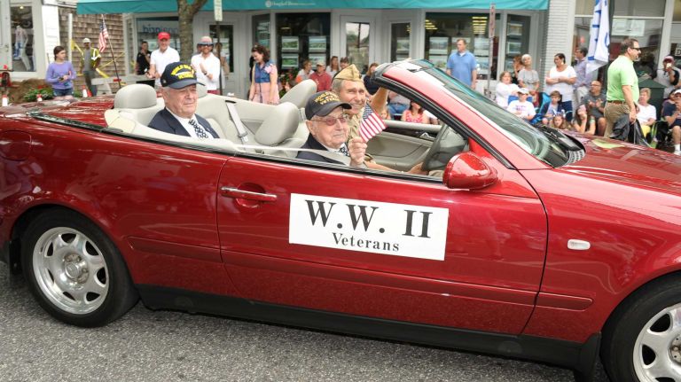World War II veterans ride at the Fourth of July parade on Saturday, July 4, 2015, in Southampton.