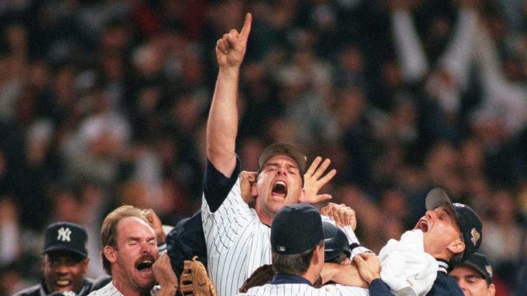 The Yankees win the World Series and celebrate on the mound around John Wetteland on Oct. 26, 1996 at Yankee Stadium against the Atlanta Braves
