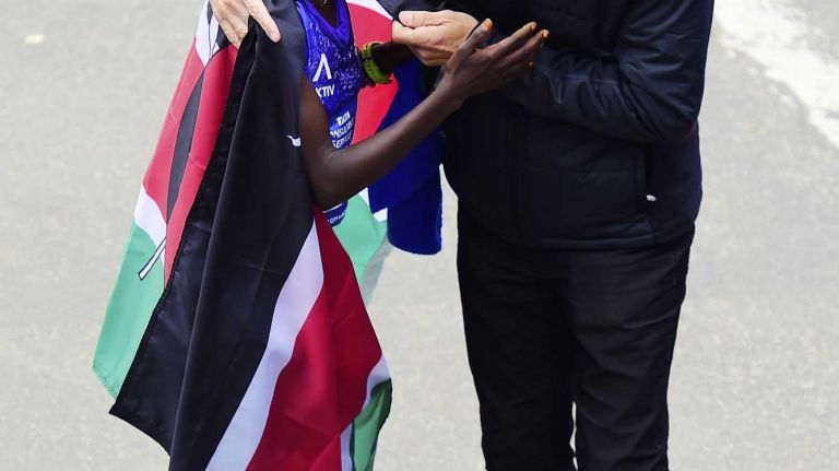 Race director Peter Ciaccia greets Mary Keitany of Kenya, who won the New York City Marathon in Manhattan on Sunday, Nov. 1, 2015.