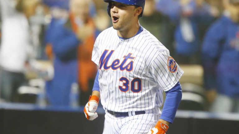 New York Mets left fielder Michael Conforto celebrates his third inning home run during Game 4 of the World Series against the Kansas City Royals at Citi Field on Saturday, Oct. 31, 2015.