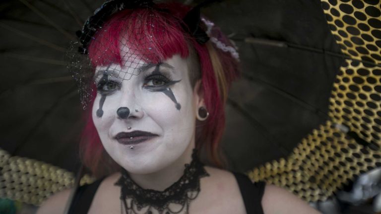 2015 Coney Island Mermaid Parade photos 27 Nola Star, a Coney Island fire breather from Crown Heights, waits in the rain before the Mermaid Parade on June 20, 2015.