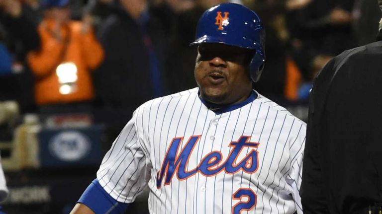 New York Mets' Juan Uribe scores on a hit by third baseman David Wright in the sixth inning during Game 3 of the World Series against the Kansas City Royals at Citi Field on Friday, Oct. 30, 2015.